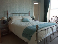 A view of Room 3 - king-sized bed