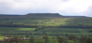 A view over the village of Askrigg (bottom left in photograph) to Addlebrough